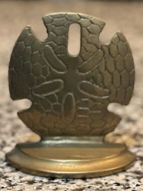 Brass sand dollar book end